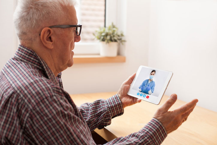 senior using tablet for telehealth visit